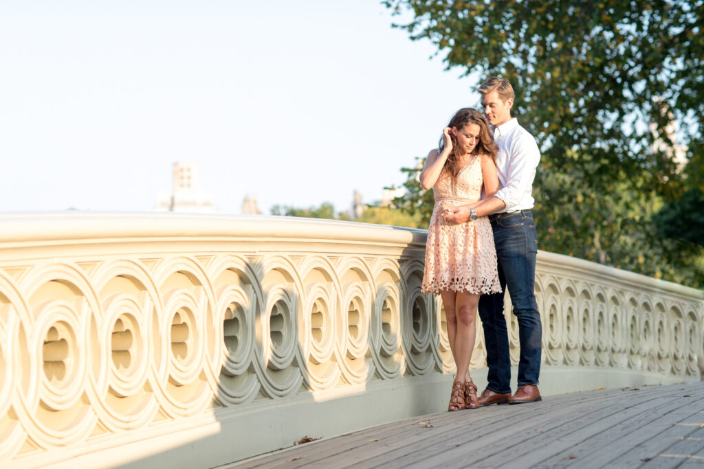 couple on bow bridge in central park nyc