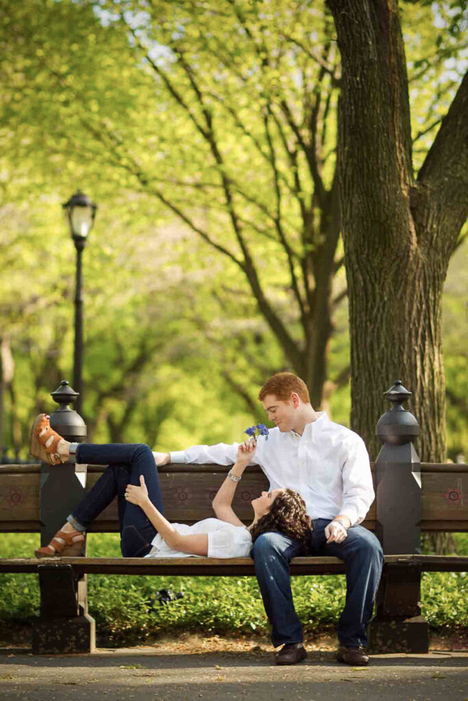 engaged couple in Central Park NYC on bench