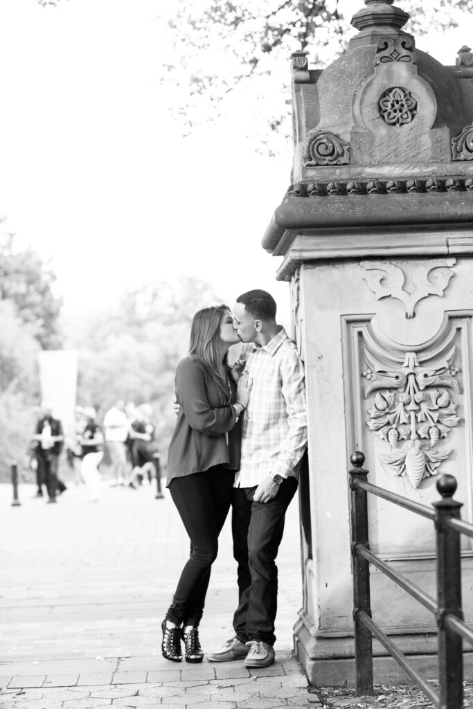 black and white photo of couple on Bethesda Terrace in Central Park nyc