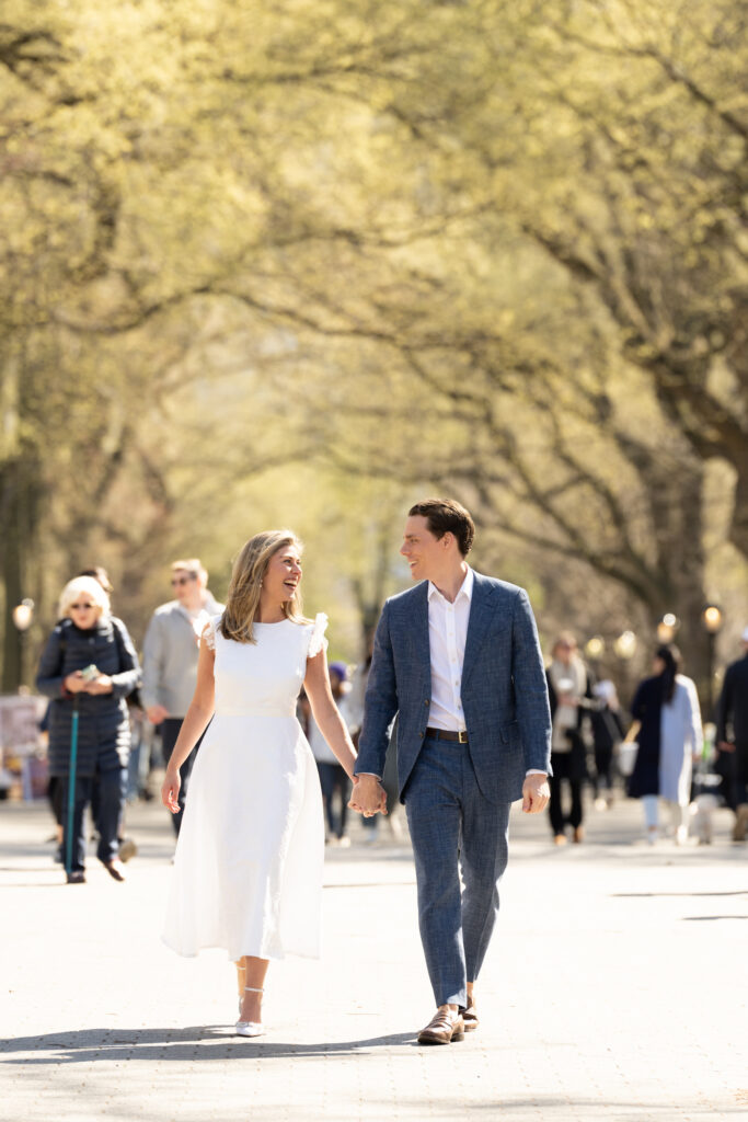 couple walking along the mall and literary walk in Central Park nyc