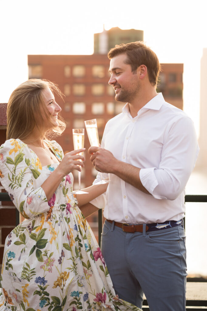 engaged couple on their rooftop in Battery Park NYC