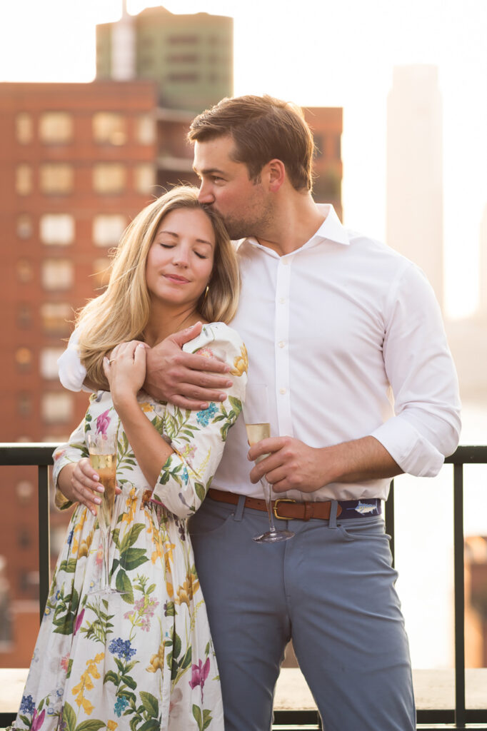 engaged couple on their rooftop in Battery Park NYC