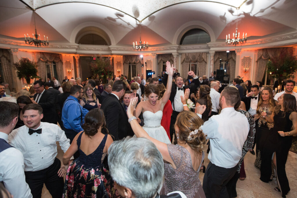 bride and groom dancing with guests