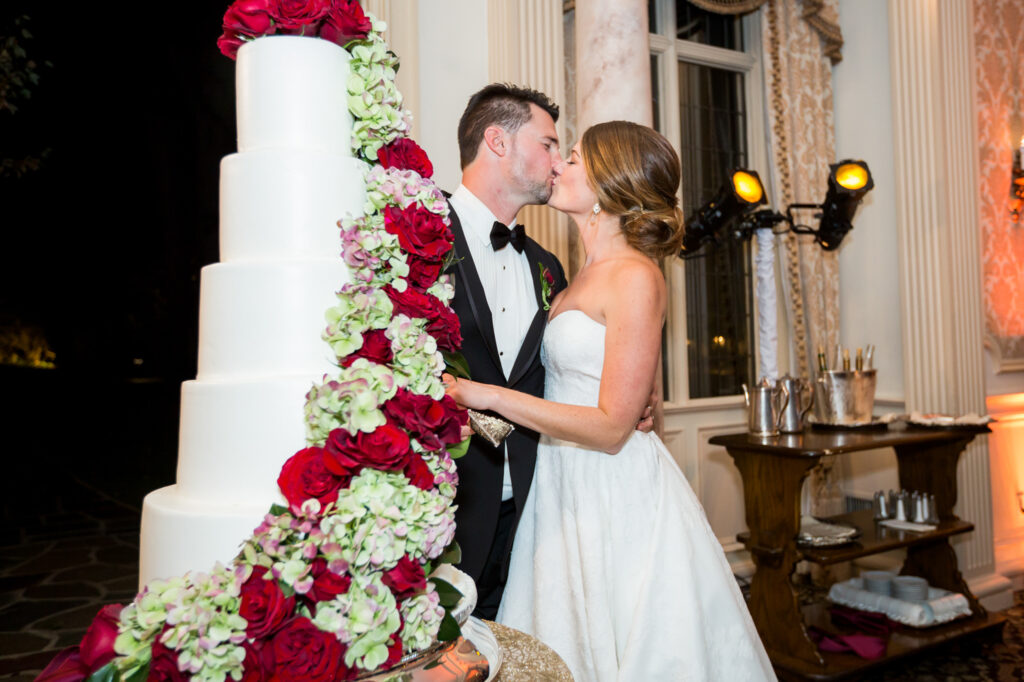 bride and groom cutting wedding cake