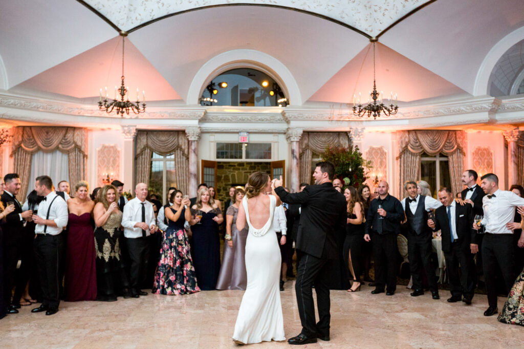 bride entering ballroom in new gown