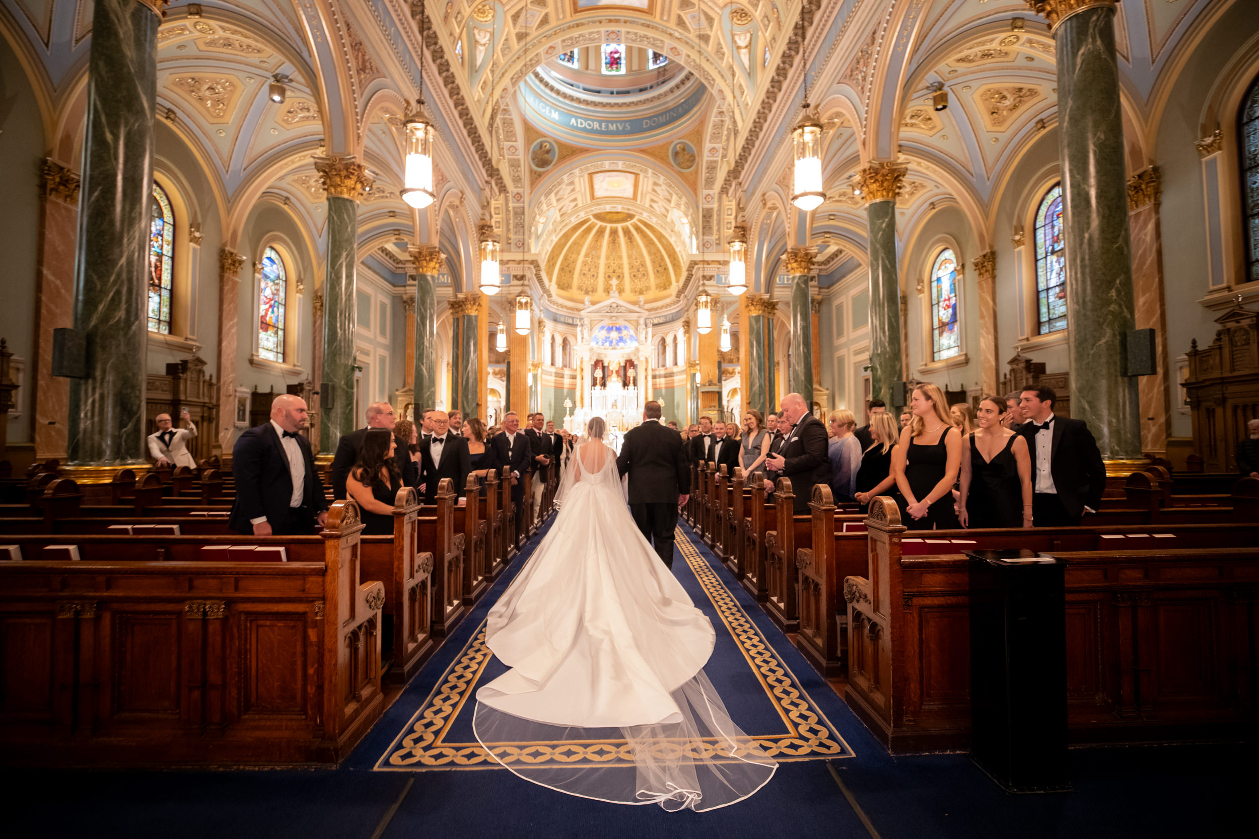 bride walking into her church ceremony at St. John Baptiste NYC