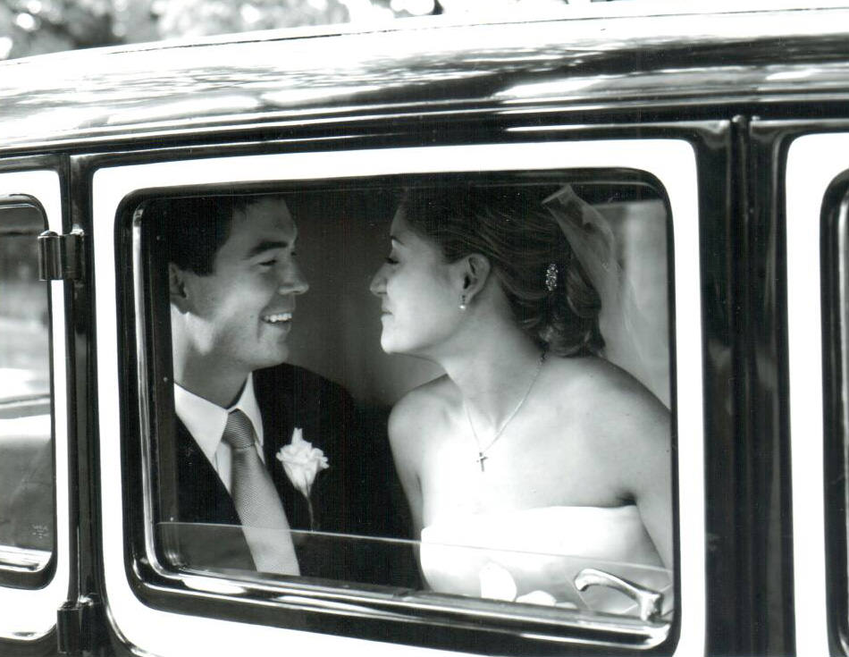 bride and groom inside their limo
